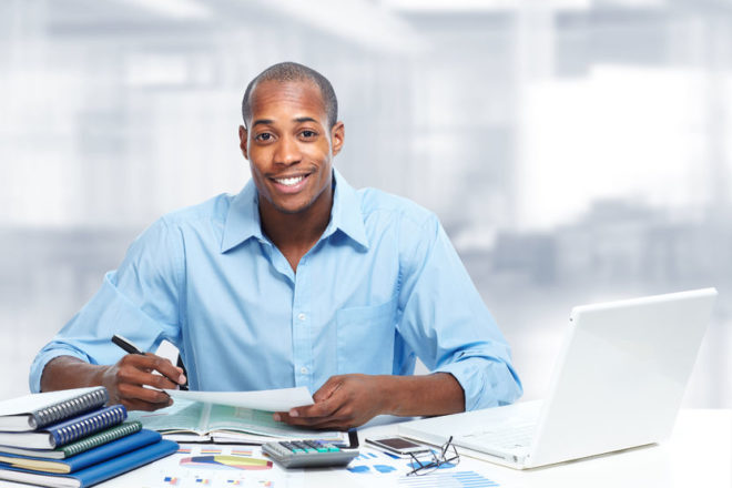 35194486 - african-american black businessman in office.